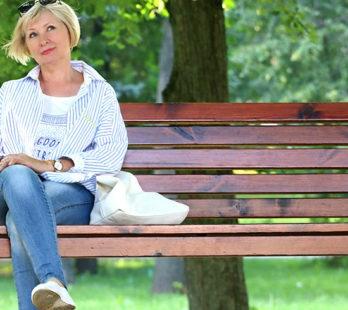 woman thinking about a bone density scan on a park bench