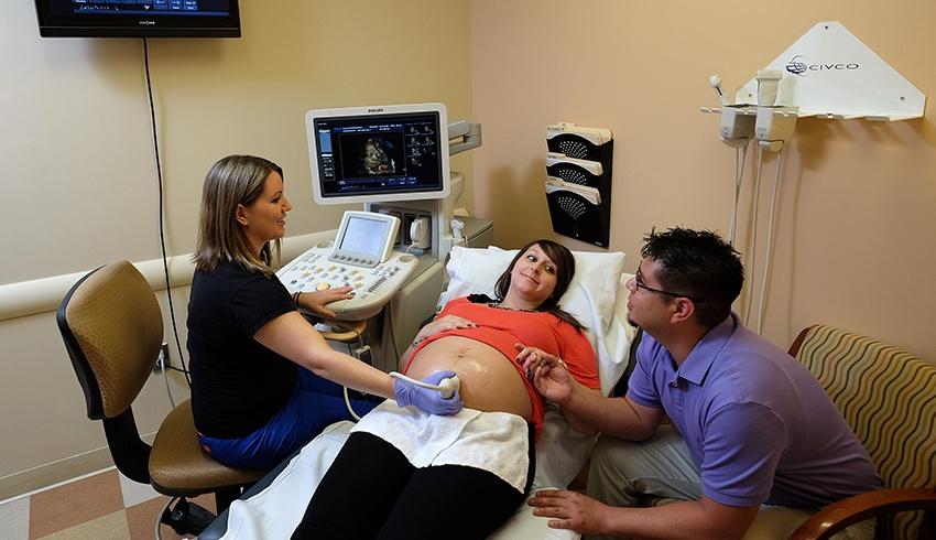 woman receiving an ultrasound in a diagnostic imaging center