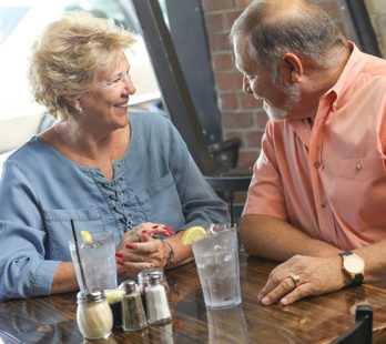 man at a restaurant with his wife