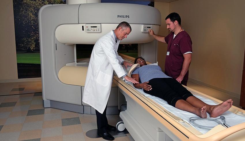 patient, radiologist, and true open mri machine
