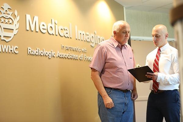 radiologist speaking to patient at medical imaging of fredericksburg